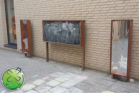 Beautiful exterior arrangement of 2 distorting mirrors in combination with a blackboard.